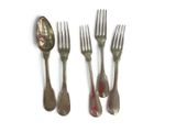 four forks and two spoons on a white surface