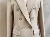 an image of a woman ' s jacket on a mannequin