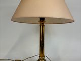 a lamp that is sitting on a table next to a wall