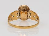 an image of a gold ring with a bird on it
