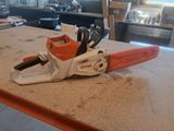 a chainsaw sitting on a counter top in a room