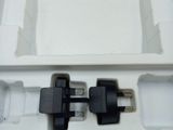 a white box with two black plugs in it
