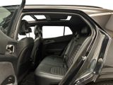 a car with the door open and the seats down