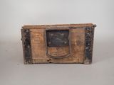an old wooden box with a handle on it