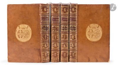 an image of a set of four books with gold medallions on them
