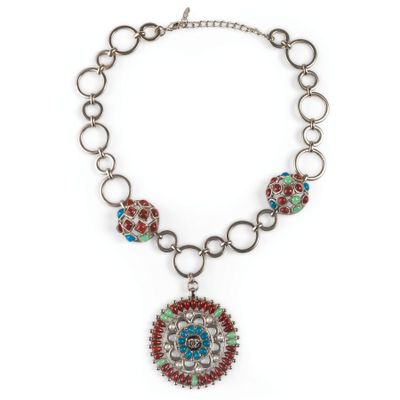a necklace with a medallion pendant on a chain