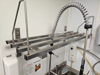 an image of a kitchen with a sink and a faucet