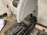 someone is using a circular saw to cut a piece of wood