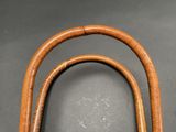 a wooden handle that is attached to a cane