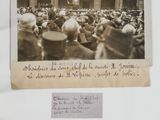an old photo of a crowd of people in front of a building