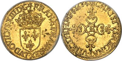 une pièce souveraine en or surmontée d'une couronne