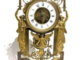 a clock that is sitting on a marble base