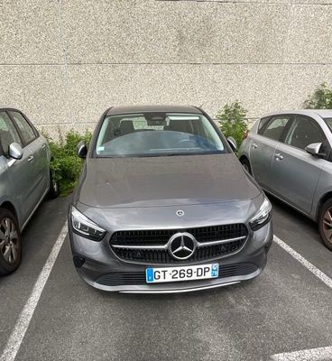 three cars parked in a parking lot next to each other