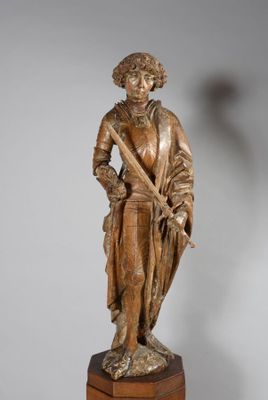 statue of a man with a cane and a hat on a wooden base