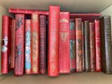 a box full of books that are sitting on a shelf