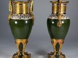 pair of green and gold vases with handles and handles