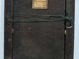 a picture of an old wooden box with a label on it