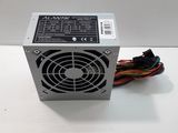 a computer power supply unit on a white surface