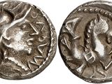 a silver coin with an image of a man on it