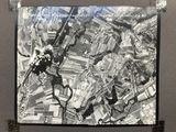 black and white photograph of an aerial view of a city