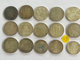 a lot of coins that are sitting on a table