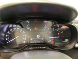 a close up of a car dashboard with a speedometer and gauges
