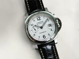 a close up of a watch on a white surface