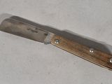 a knife that is laying on a table
