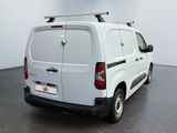 a white van with a surfboard on the top of it