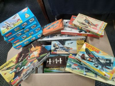a box full of toys and books on a table