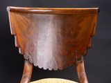 an image of a wooden chair with a wicker seat