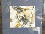 tableau représentant une femme avec un chat sur le dos, dans un cadre en bois