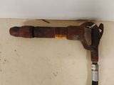 a pipe cutter on the wall next to a pipe cutter