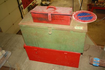 boxes are stacked on top of each other in a garage