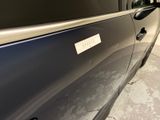 a close up of a car door with a sticker on it
