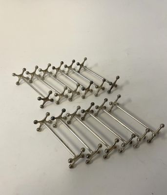 a set of six antique silver plated hooks
