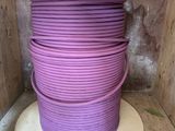an image of a spool of purple electrical wire in a wooden box