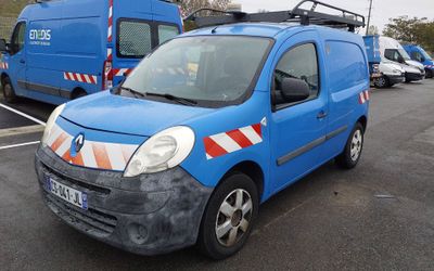 a blue van that is parked in a parking lot