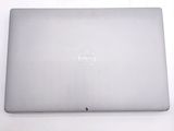 dell laptop computer sitting on a white surface with a dell logo on the screen