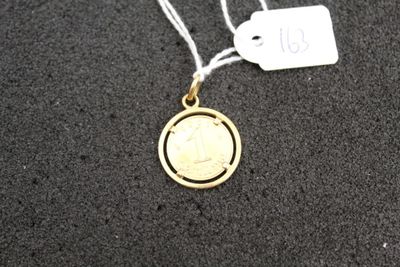 a gold coin on a string with a price tag on it