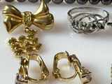 many different types of rings and bracelets on a table