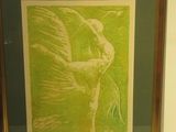 painting of a bird in a gold frame on a white wall