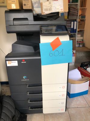 a multi - function printer sitting on top of a stack of boxes