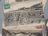 many old photos of people on the beach on the table