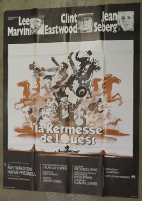 a movie poster on the wall of a bathroom