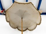 a white umbrella that is hanging from the ceiling