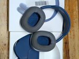 a pair of headphones sitting on top of a wooden table