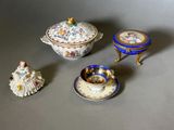 three different types of porcelain items sitting on a table