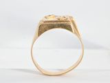 an 18k gold signet ring with a square signet in the center