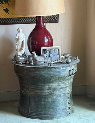 a lamp that is sitting on a table with a picture on it